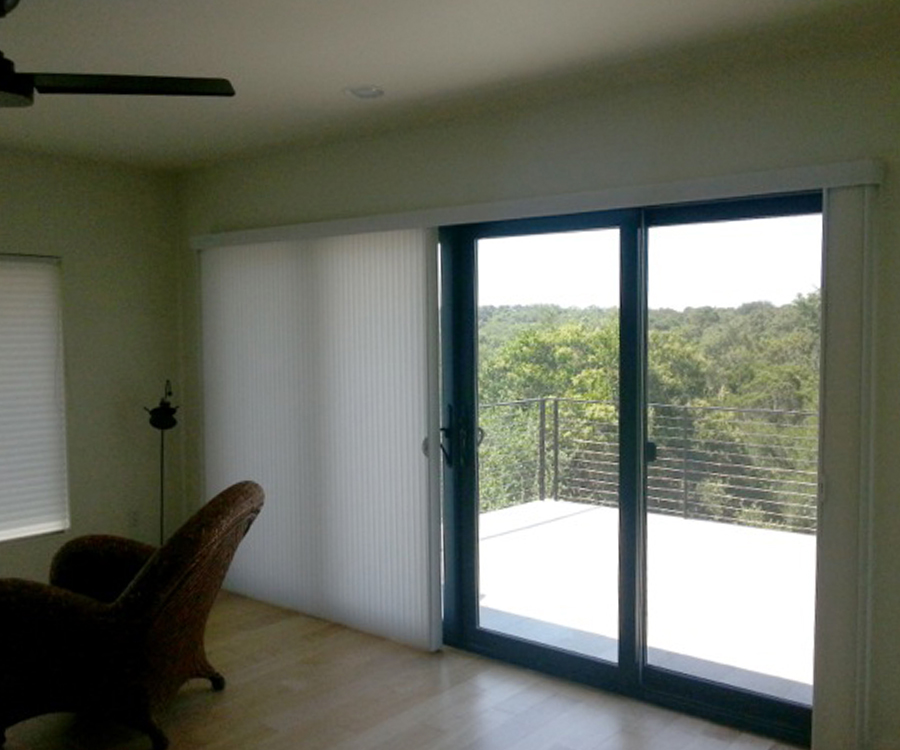 vertical honeycomb shades on glass doors in Austin TX