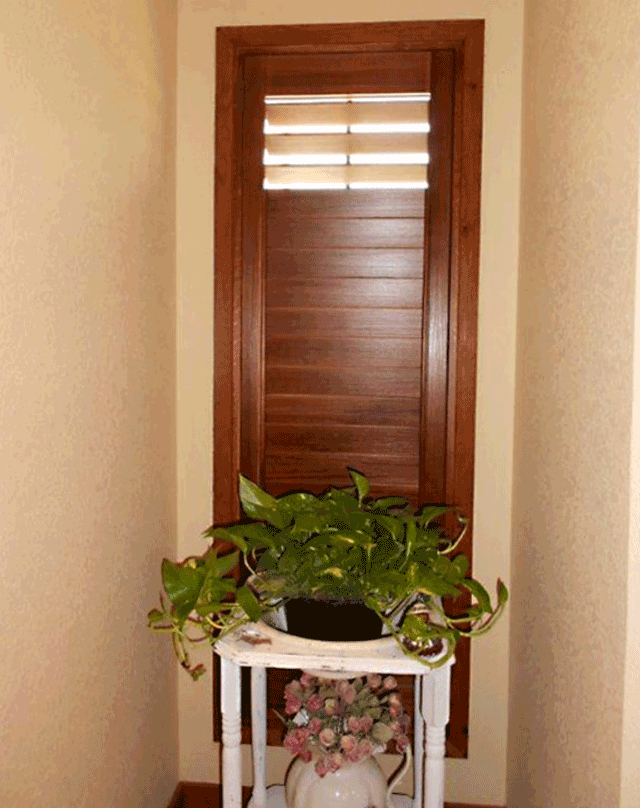 brown wooden shutters bathroom design solutions Austin 78758