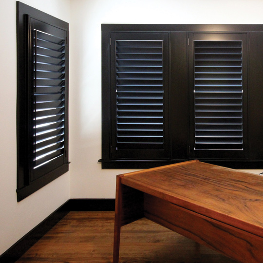 interior window shutters dark wood hinged panel plantation shutters Austin 78731