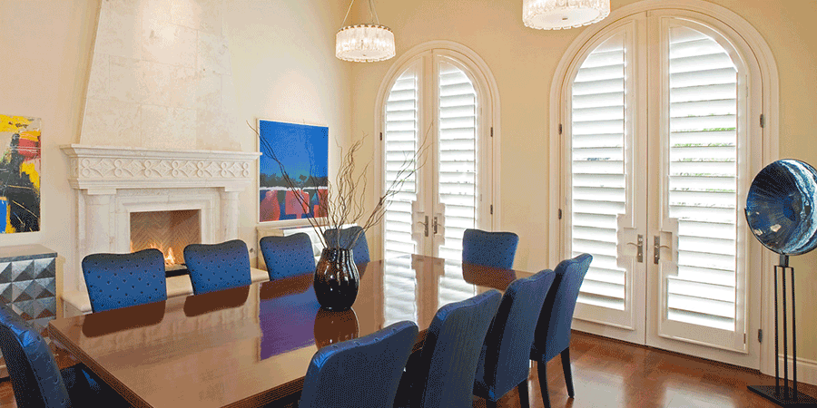 Dining room showing benefits of plantation shutters on doors.