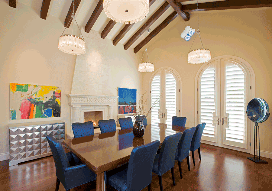 Dining room showing benefits of plantation shutters on doors.