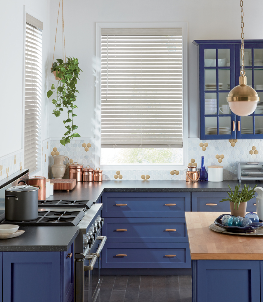 hunter douglas white faux wood blinds in blue kitchen Austin TX