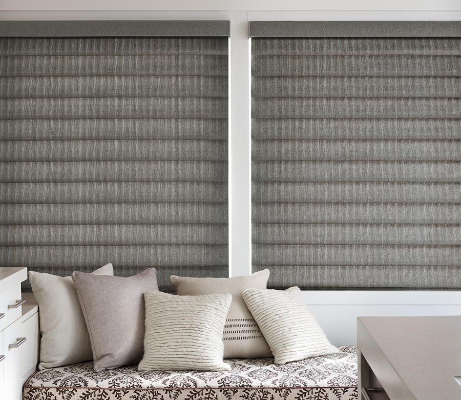 living room sitting area with neutral colors and roman shades austin