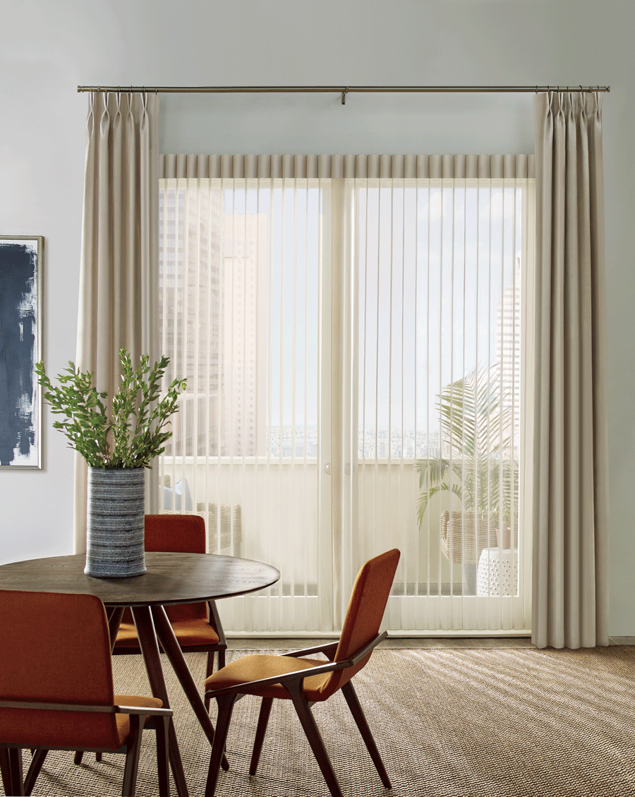 Sliding doors with luminette privacy sheers and side drapery panels.