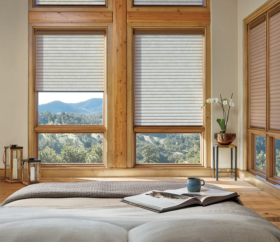 bedroom with energy efficient cellular roller shades