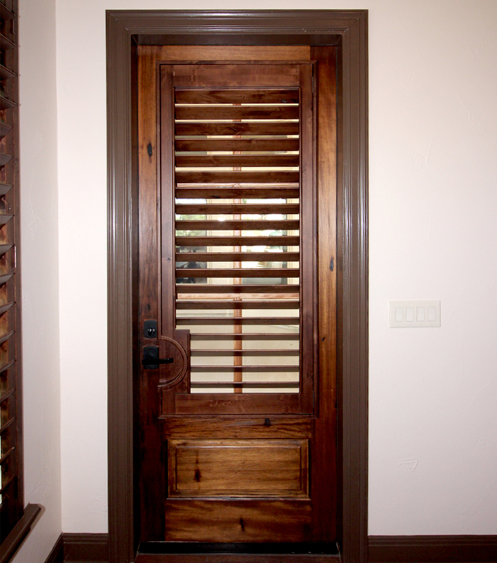 cover glass doors with knotty alder wood shutters in Austin TX