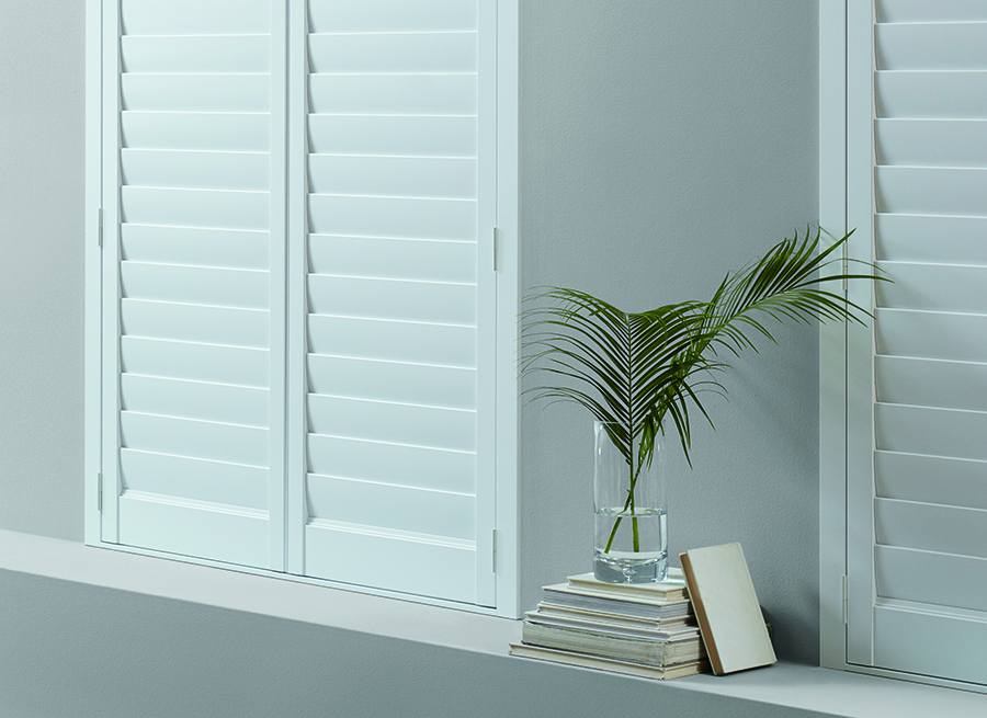 White interior shutters with vanes shut