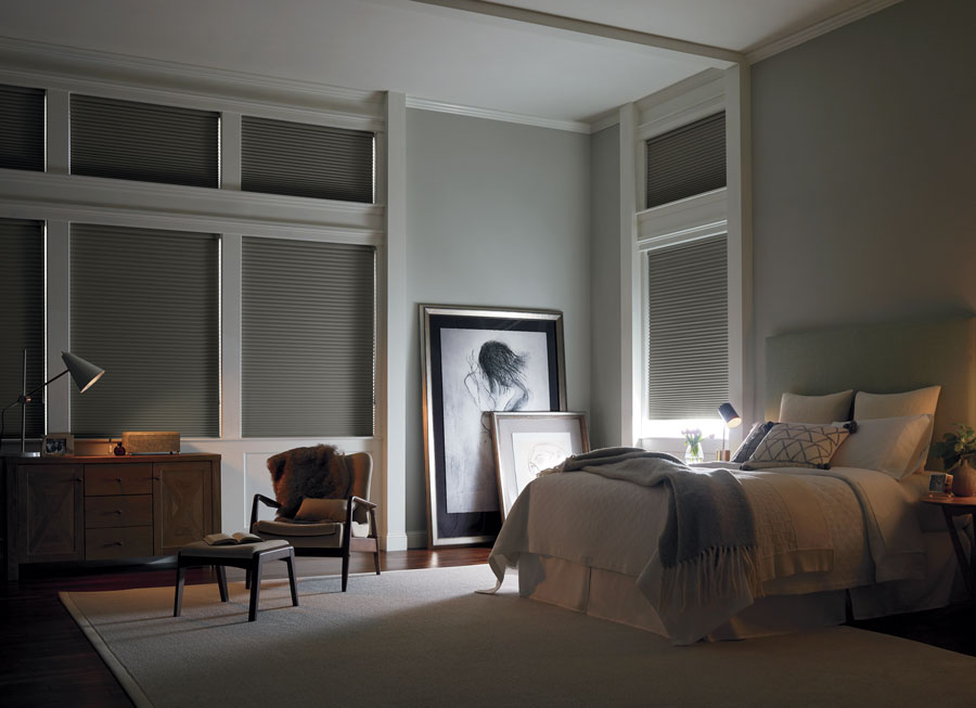 room darkening shades on tall windows for window covering solutions in Austin TX bedroom