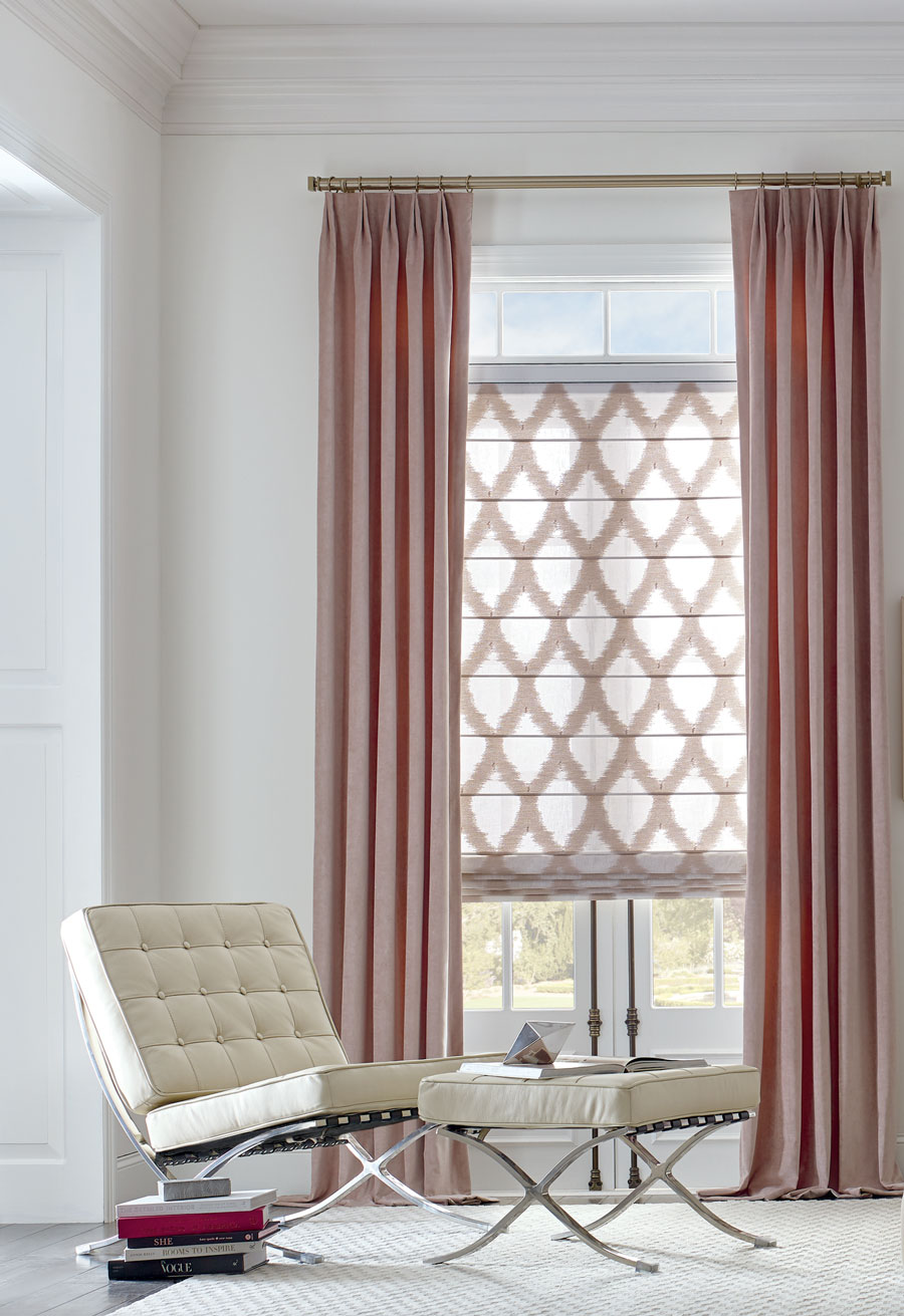 rose pink drapery and patterned roman shades in modern white living room