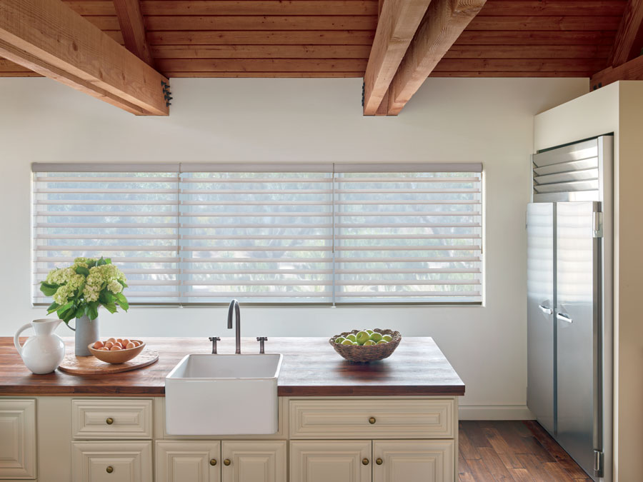 large kitchen window with wand motorization in Austin TX home