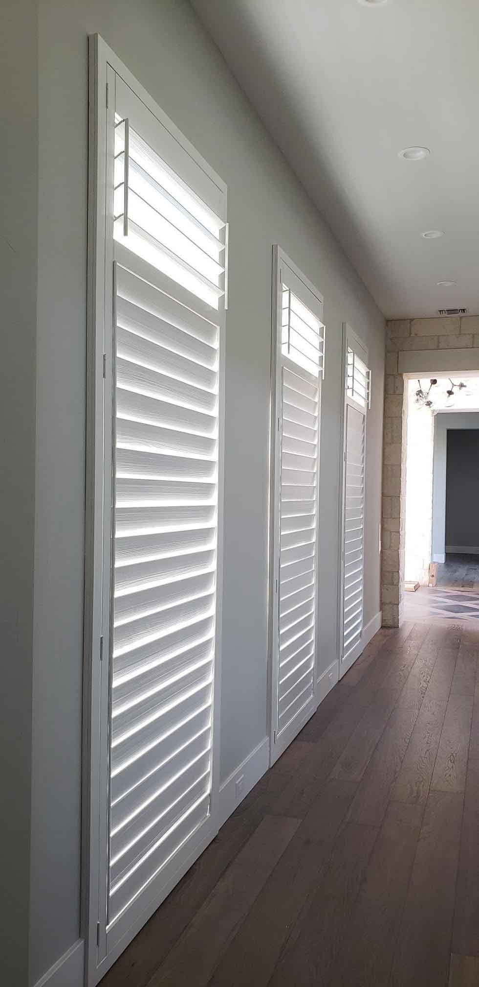 white hardwood shutters in hallway in Austin, TX