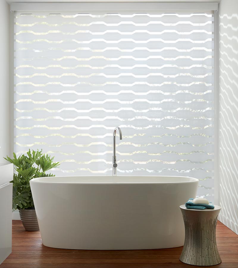 geometric pattern window coverings with automation in modern white bathroom Cedar Park, TX