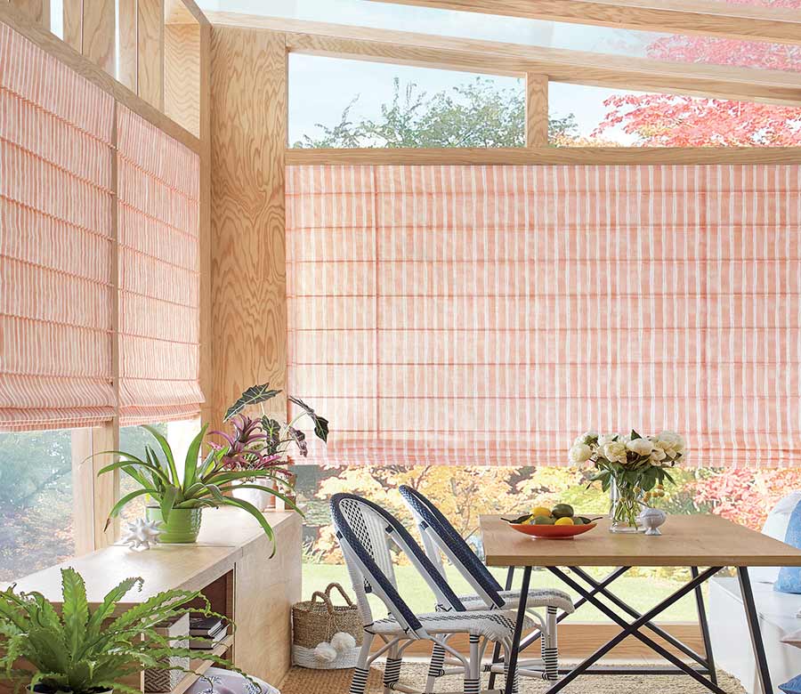 outdoor sunroom with pink coral striped window shadings