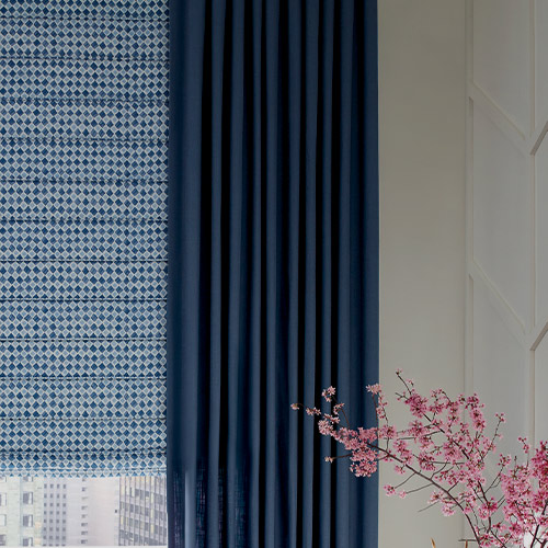 room darkening window shades and drapery in blue