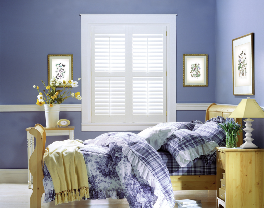 white shutters in very peri painted walls in bedroom in Austin TX