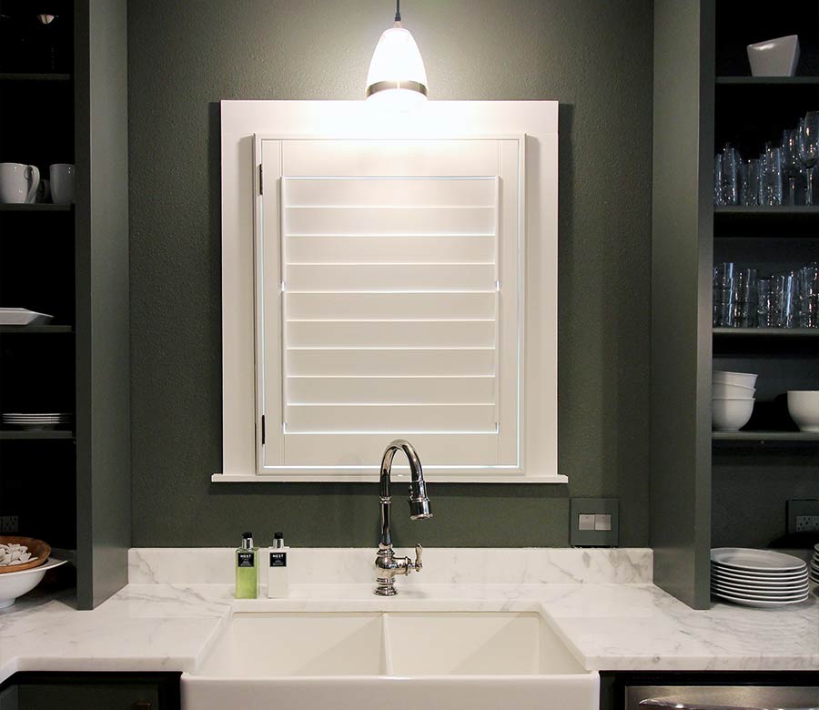 green kitchen sink white shutters in Austin TX