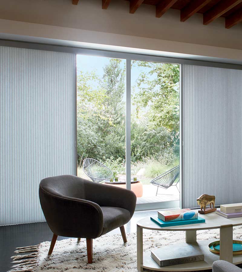 Duette honeycomb shades on sliding glass patio doors for floor to ceiling window treatments in Austin, TX