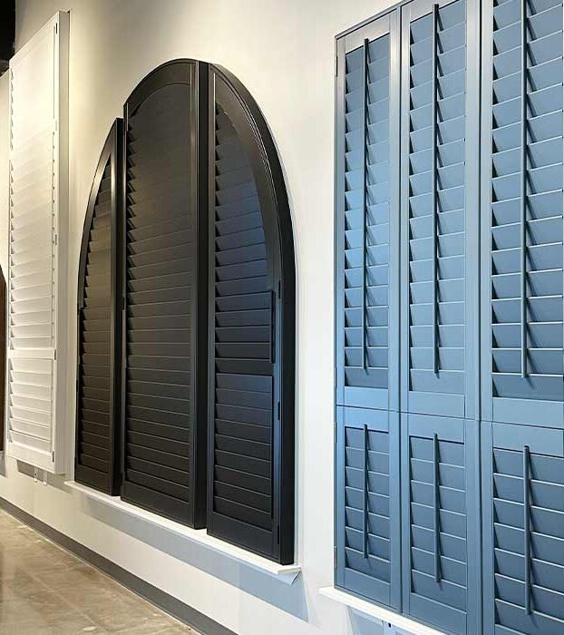 painted and wood shutters on the wall at showroom in austin, tx