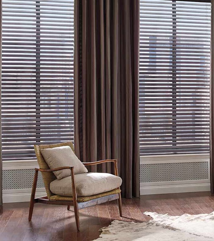 mahogany color blinds framed by dark brown drapery panels