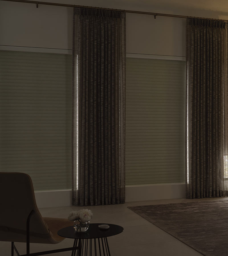 cream blackout shades on bedroom windows in austin paired with custom drapery