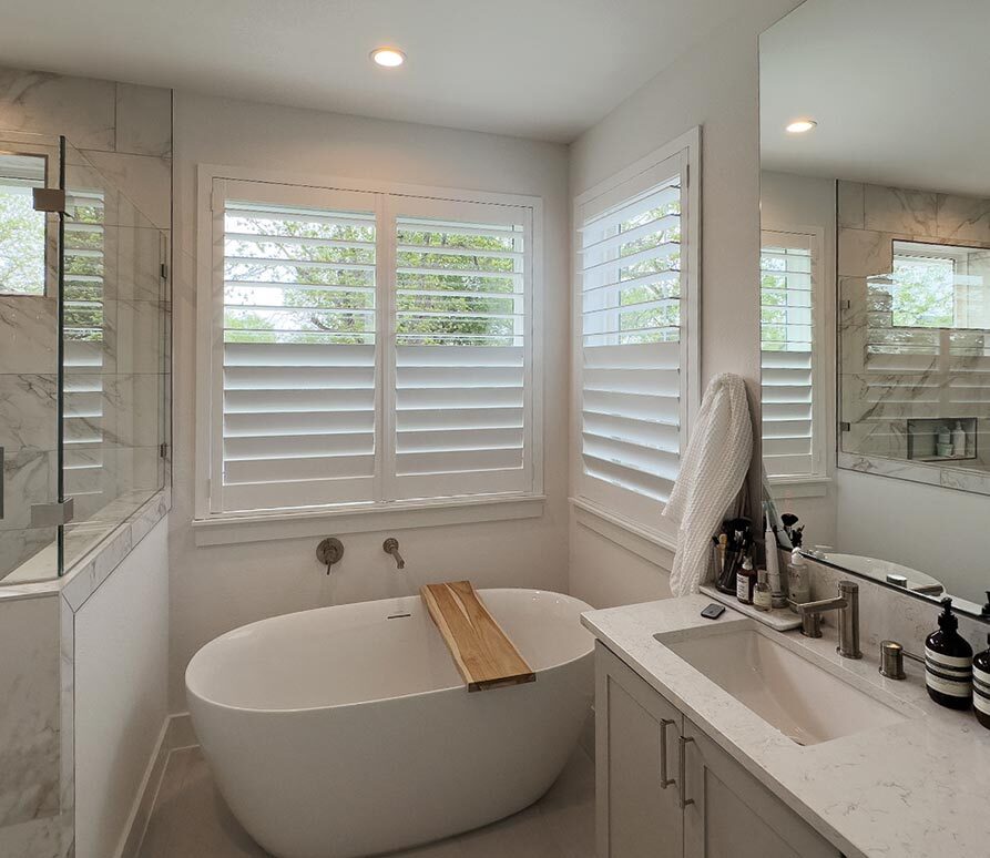 shutters-bathroom-with-tub-austin-window-fashions bathroom with large tub and white shutters
