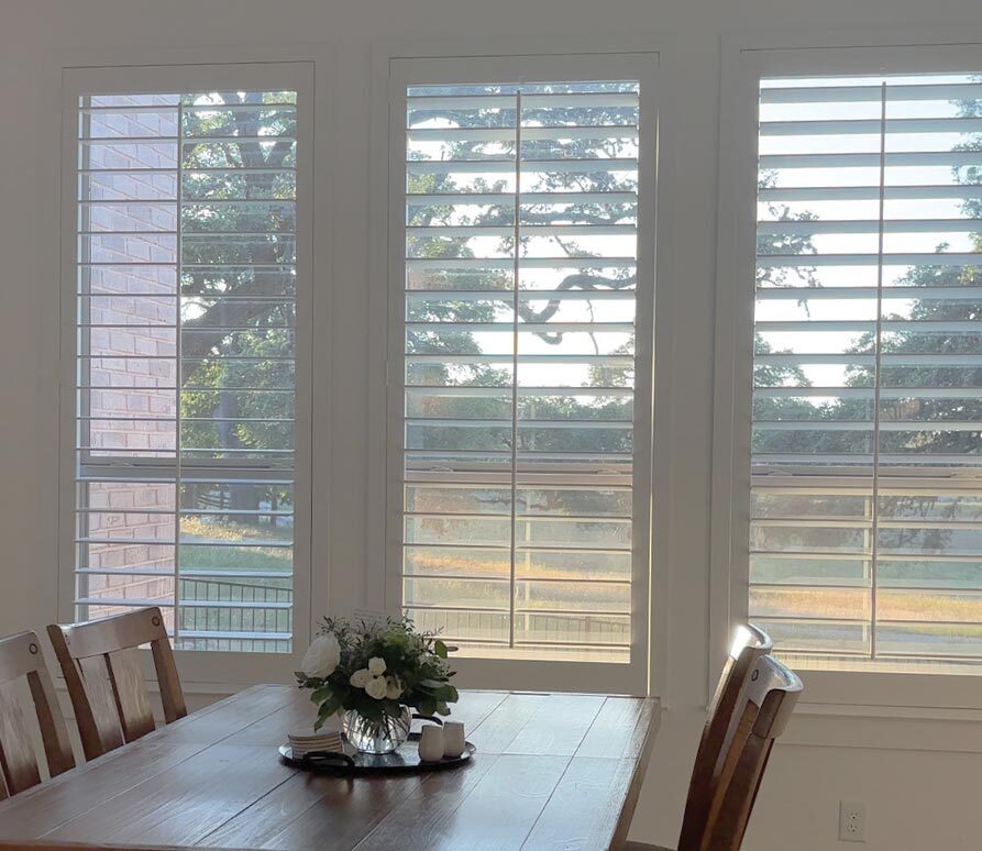 shutters-dining-room-table-austin-window-fashions white shutters in dining room austin window fashions