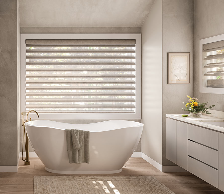 bathroom with tub and pirouette window treatments