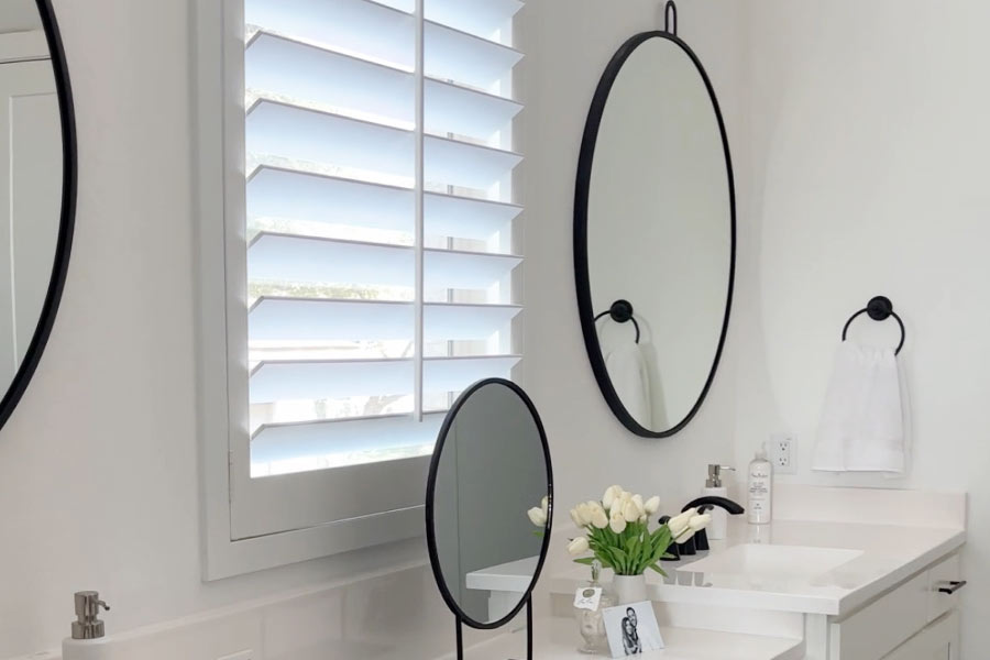 white shutters in bathroom vanity area