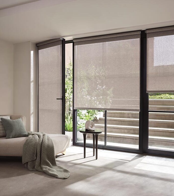 living room with large window screen shades for light filtering
